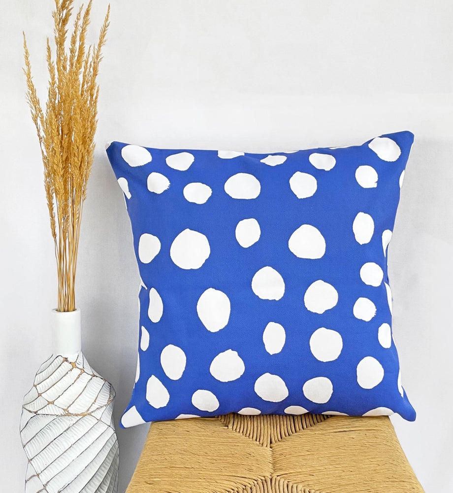 royal blue pillow with white spots